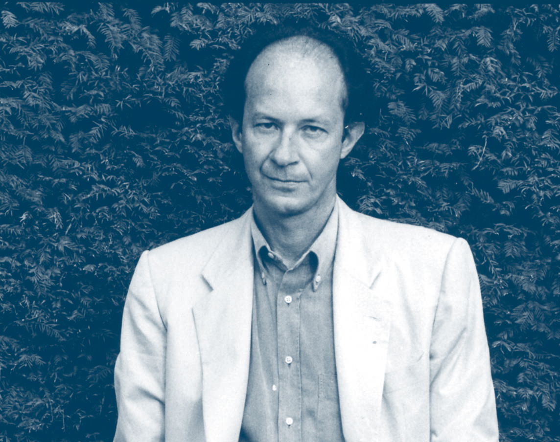 Giorgio Agamben looking at the camera in shades of gray